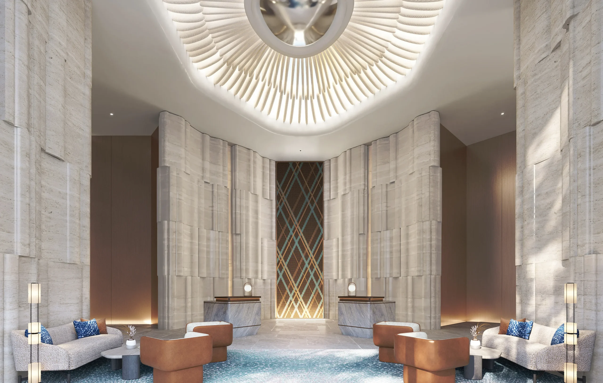 Lobby de las residencias W by Marriott Al Marjan Island, con paredes de piedra, luminaria radial en el techo y zona de estar